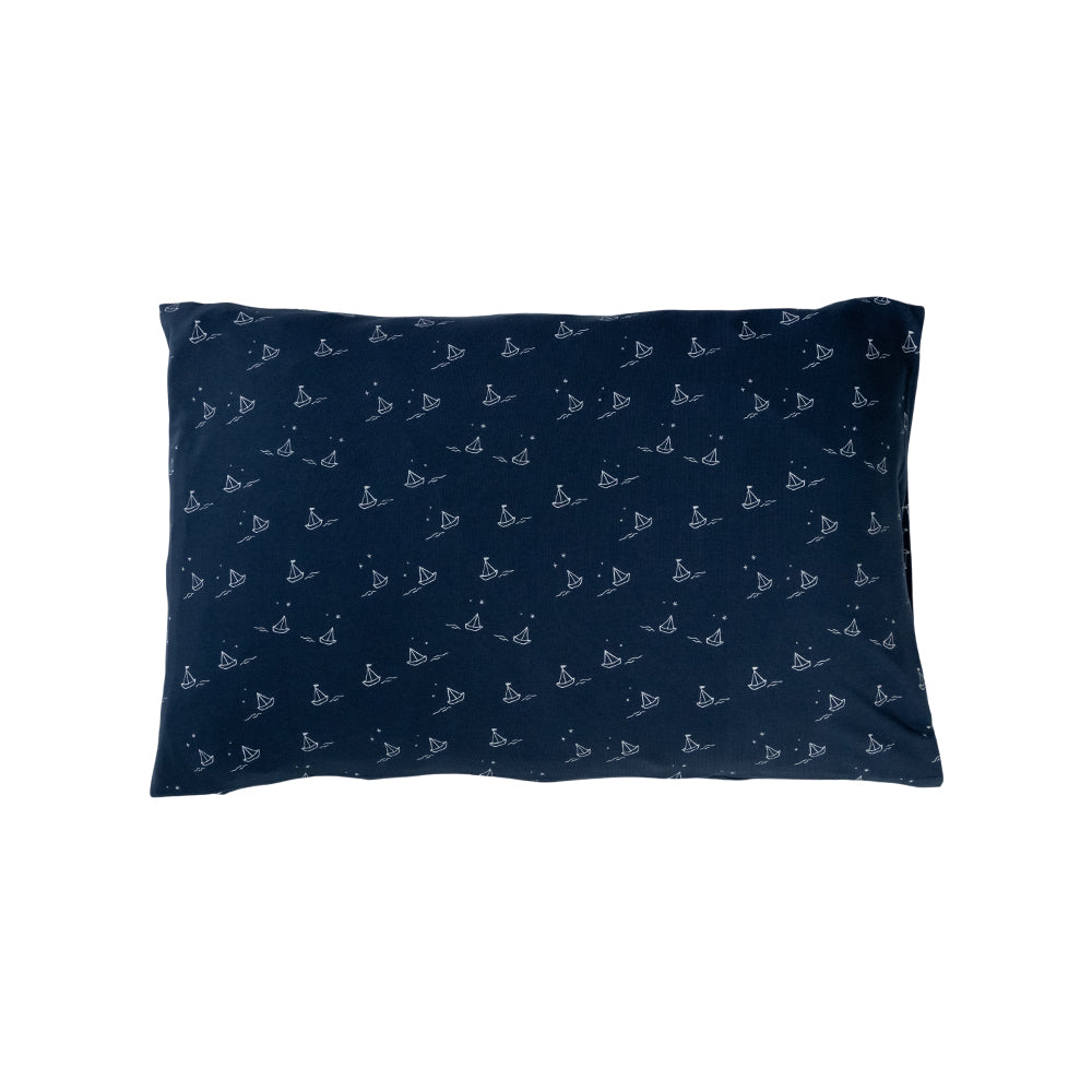 Cotton toddler pillowcase on a white background. Navy base with an all over sailboat print. 