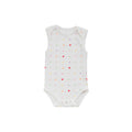 Organic cotton singletsuit on a white background. White base with an all over hearts print. 