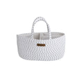 white nappy caddy with black specks and brown brand tag on front