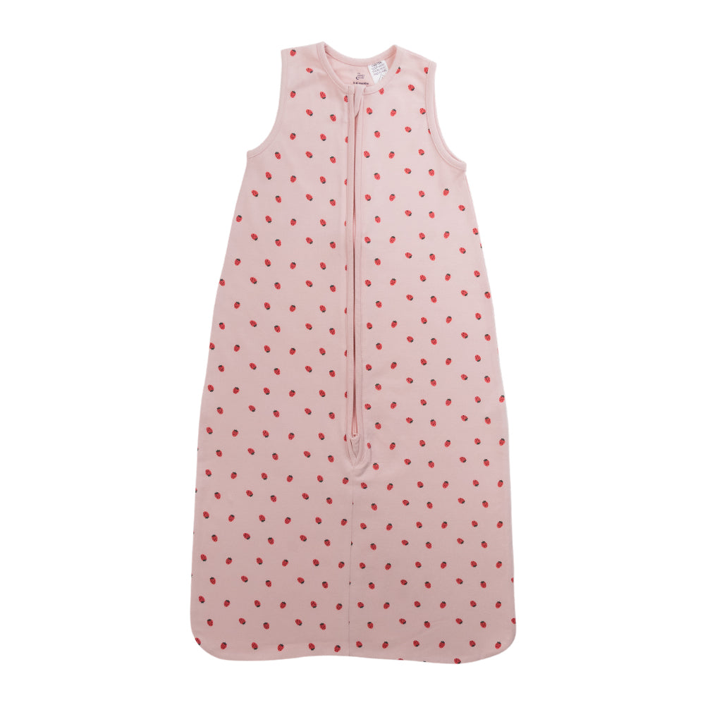 A sleeveless cotton baby sleep sack with strawberries on a pink background, shown flat against a white background.