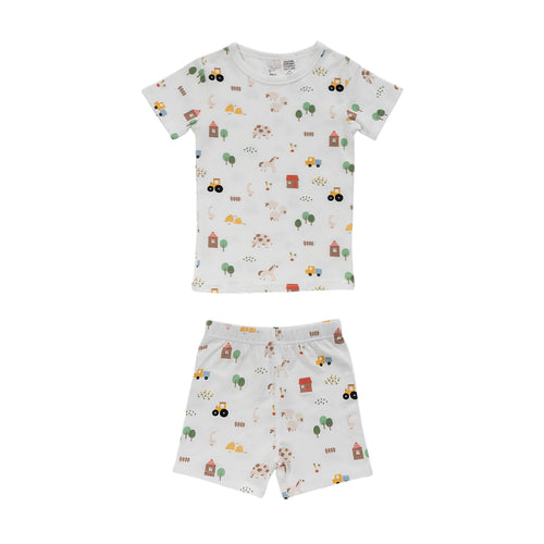 Cotton summer Pjs on a white base with an all over farmyard print on a white background. 