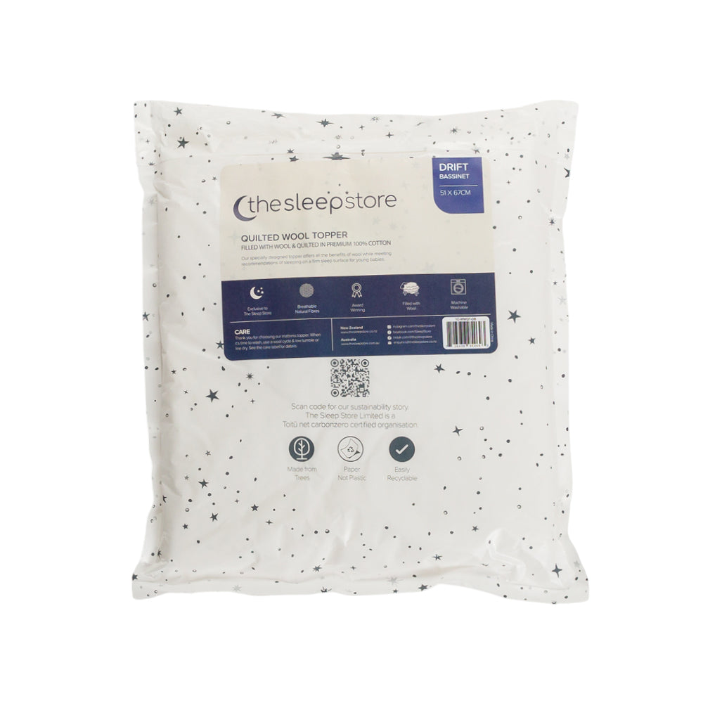 Quilted wool topper packaging with brand label on a white background