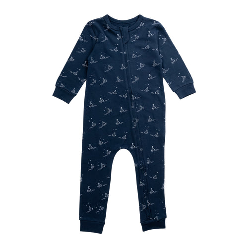 Cotton Zipsuit with a navy base and an all over sailboat print on a white background. 