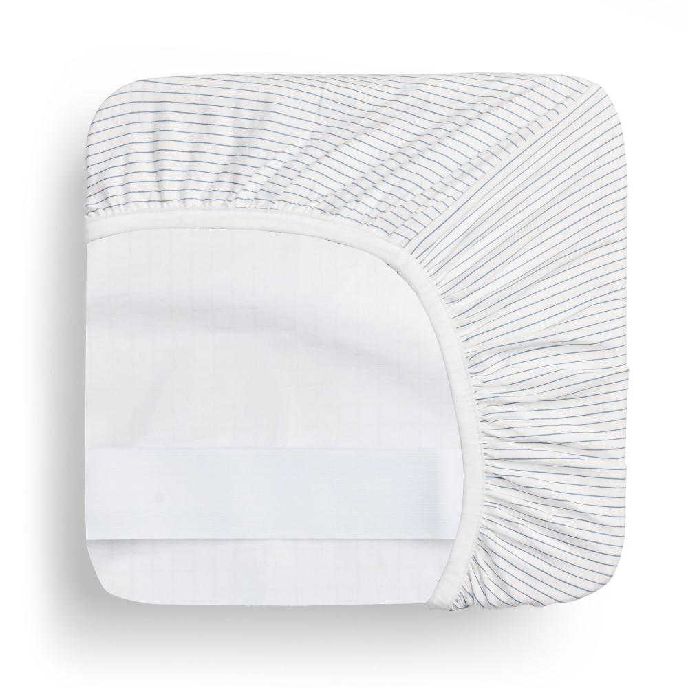A waterproof fitted sheet shown on a mattress in Midnight Stripe pattern