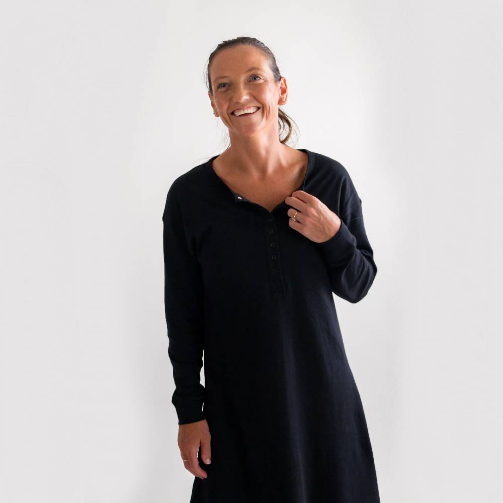 Woman wearing a black nightdress against a white background