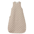 Beige quilted baby sleeveless sleeping bag with domes and a pram slot on a white background